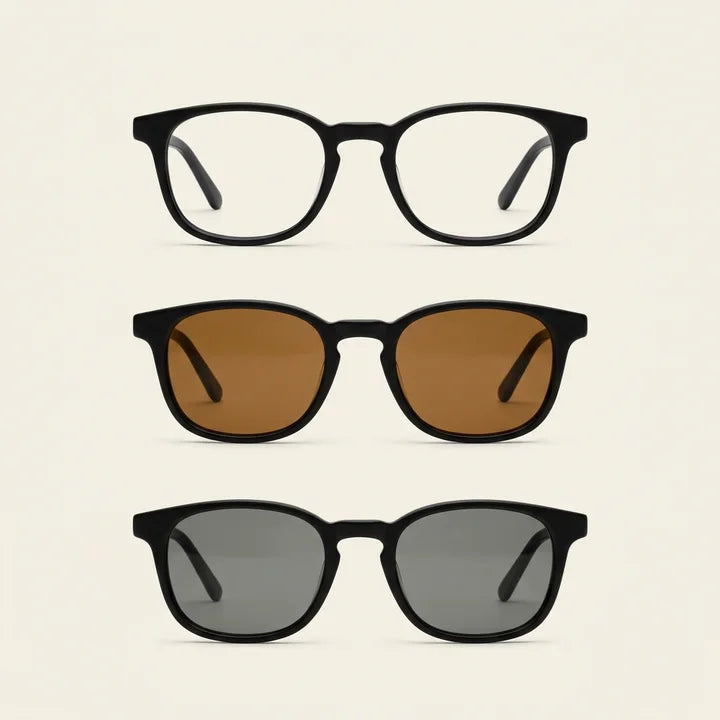 The same black frame shown with clear, amber and smoke-grey lenses, from top to bottom.